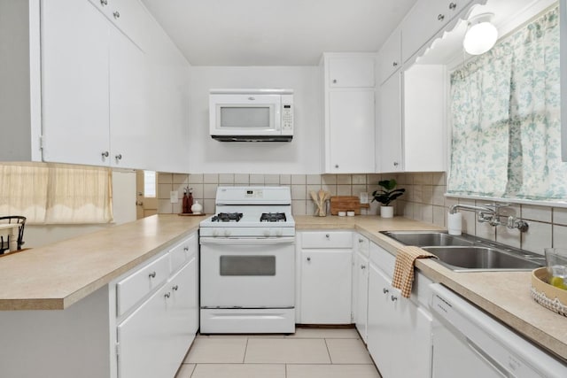 1409 Briarcliff Blvd, Austin, TX 78723 - kitchen with white appliances, a sink, light countertops, and tasteful backsplash