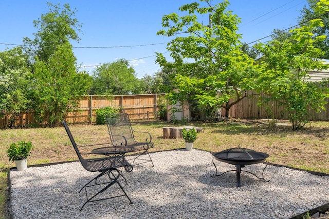1409 Briarcliff Blvd, Austin, TX 78723 - fenced backyard featuring an outdoor fire pit and a patio