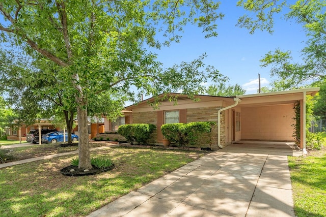 1409 Briarcliff Blvd, Austin, TX 78723 - ranch-style house with driveway, a carport, and a front lawn