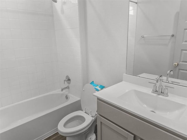 full bath with toilet, bathing tub / shower combination, and vanity