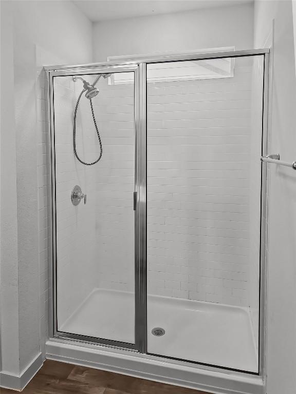 bathroom featuring a shower stall