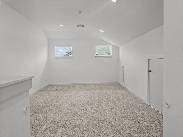 additional living space with lofted ceiling, carpet floors, baseboards, and recessed lighting