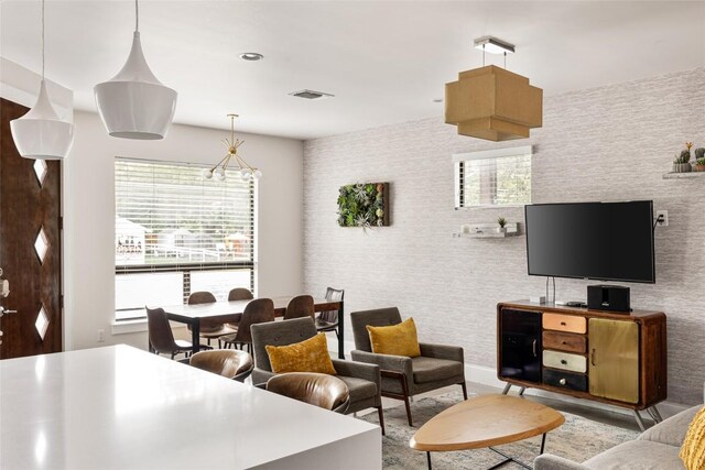 1103 12th St E, Austin, TX 78702 - living area with healthy amount of natural light and wallpapered walls