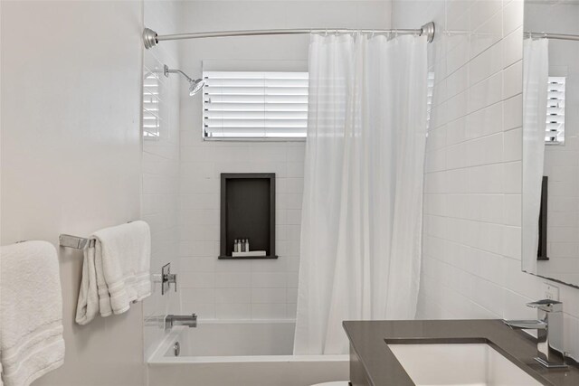 1103 12th St E, Austin, TX 78702 - bathroom with vanity, shower / tub combo, and toilet