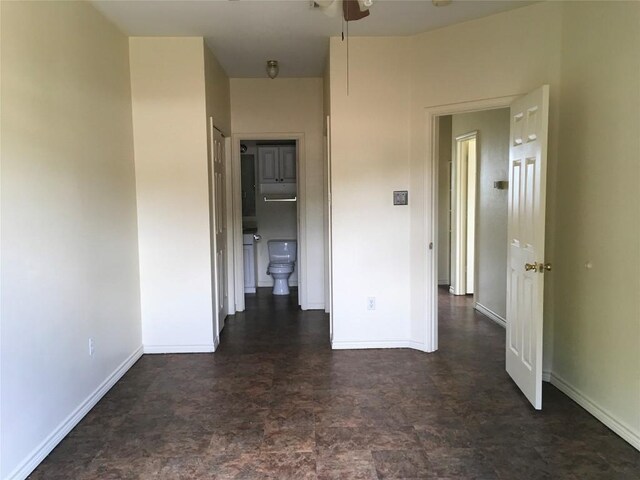 251 Zimmerman Ave A-B-C-D, Unit A-B-C-D, Bastrop, TX 78602 - spare room featuring baseboards, ceiling fan, and dark flooring