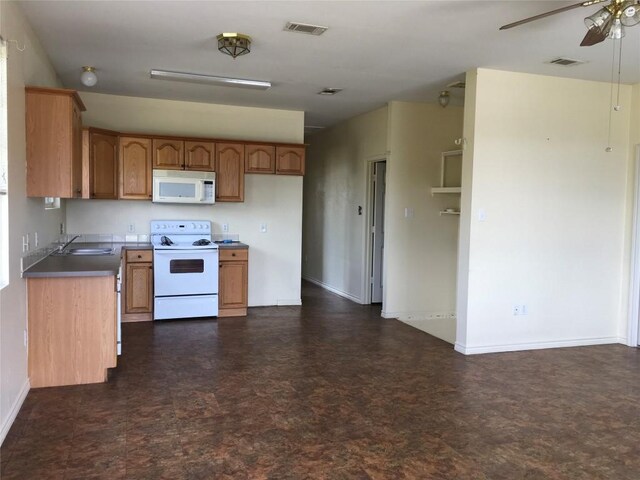 251 Zimmerman Ave A-B-C-D, Unit A-B-C-D, Bastrop, TX 78602 - kitchen featuring white appliances, brown cabinets, baseboards, a ceiling fan, and dark floors