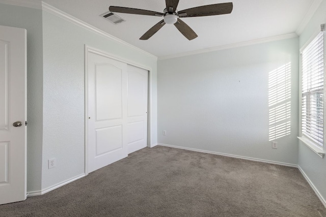 2306 Mccombs St, Georgetown, TX 78626 - unfurnished bedroom with crown molding, carpet flooring, a closet, a ceiling fan, and baseboards