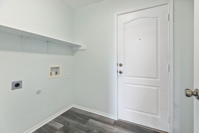 2306 Mccombs St, Georgetown, TX 78626 - laundry room with electric dryer hookup, dark wood-style flooring, hookup for a washing machine, and baseboards