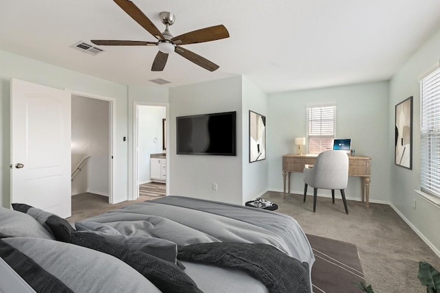 2306 Mccombs St, Georgetown, TX 78626 - carpeted bedroom with baseboards, a ceiling fan, and ensuite bath