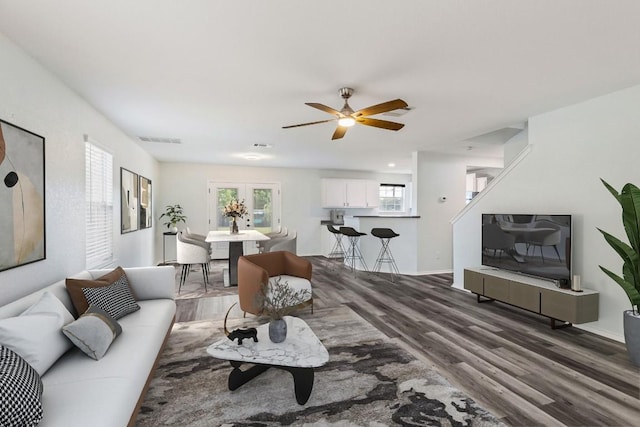 2306 Mccombs St, Georgetown, TX 78626 - living area featuring wood finished floors, a ceiling fan, and baseboards
