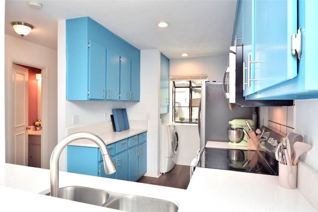 7122 Woodhollow Dr Unit 105, Austin, TX 78731 - kitchen featuring washer and dryer, blue cabinets, electric range oven, light countertops, and recessed lighting