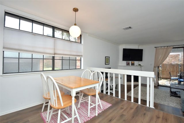 7122 Woodhollow Dr Unit 105, Austin, TX 78731 - dining room with wood finished floors and crown molding