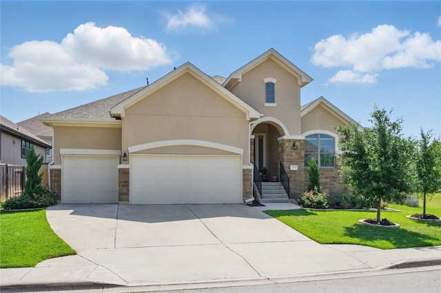 4121 Vinalopo Dr, Austin, TX 78738 - view of front of home featuring stone siding, stucco siding, a garage, a front yard, and concrete driveway
