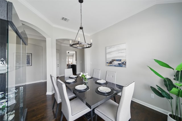 4121 Vinalopo Dr, Austin, TX 78738 - dining room featuring arched walkways, hardwood / wood-style flooring, ornamental molding, and a chandelier