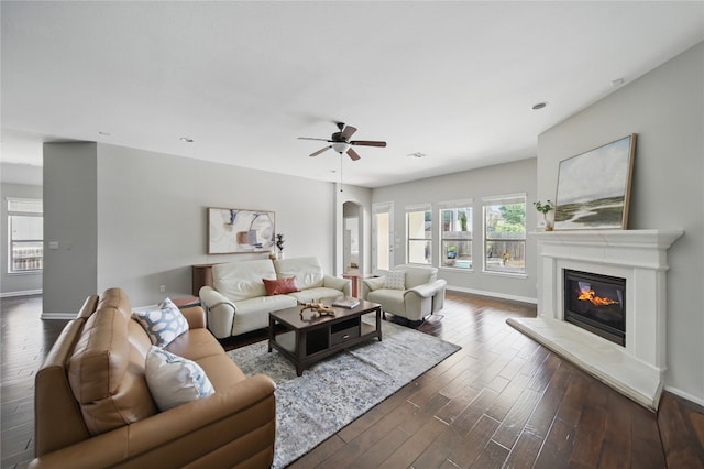 4121 Vinalopo Dr, Austin, TX 78738 - living room featuring dark wood-type flooring, ceiling fan, a glass covered fireplace, and recessed lighting