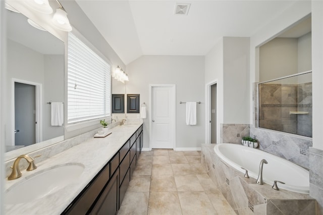 4121 Vinalopo Dr, Austin, TX 78738 - bathroom featuring vaulted ceiling, double vanity, a garden tub, and a tile shower