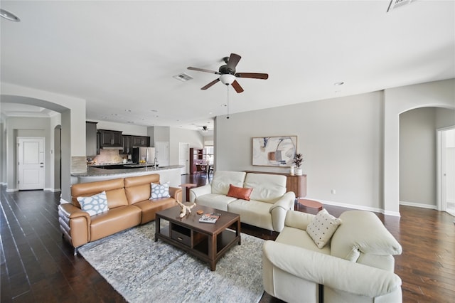4121 Vinalopo Dr, Austin, TX 78738 - living room with arched walkways, a ceiling fan, wood-type flooring, and recessed lighting