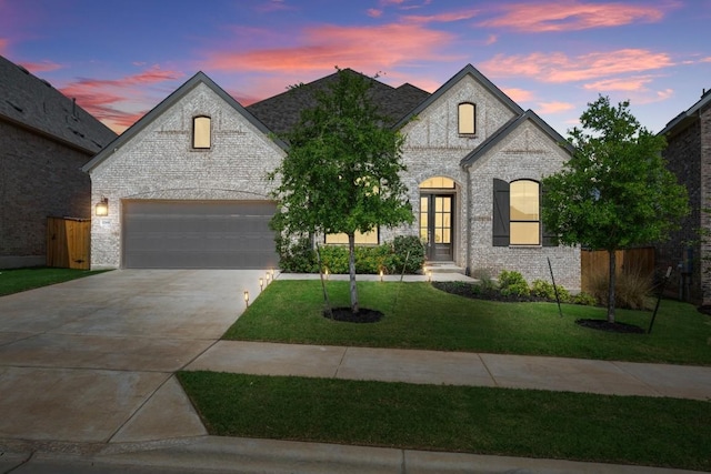 1244 Calendula Trl, Georgetown, TX 78628 - french country home with concrete driveway and brick siding