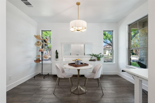 417 Wichita St, Meadowlakes, TX 78654 - dining space featuring plenty of natural light, baseboards, and dark wood-style flooring