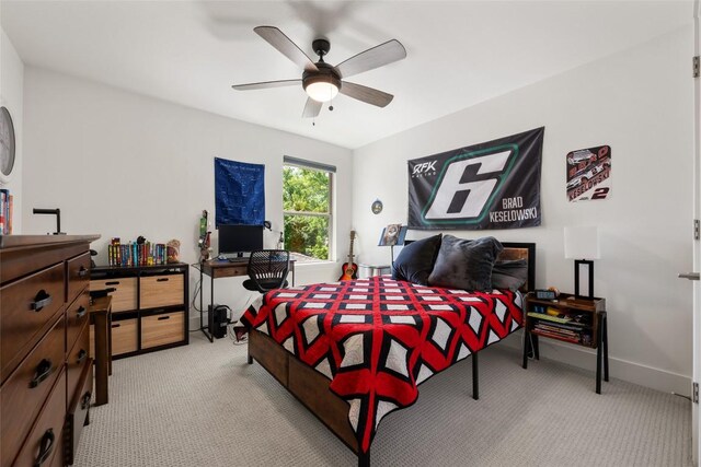 417 Wichita St, Meadowlakes, TX 78654 - bedroom with light carpet, ceiling fan, and baseboards