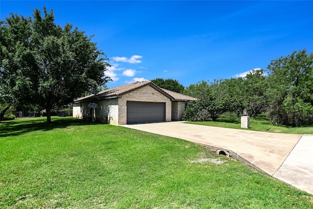 104 Springfield, Horseshoe Bay, TX 78657 - single story home with a garage, driveway, a front lawn, a tile roof, and stucco siding