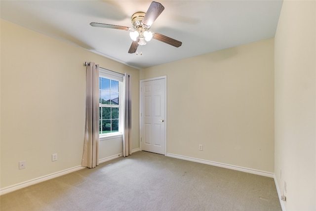 104 Springfield, Horseshoe Bay, TX 78657 - spare room featuring light colored carpet, baseboards, and a ceiling fan