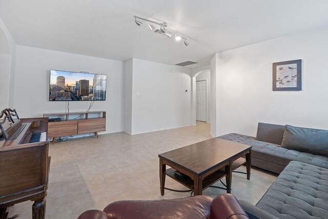 living room with arched walkways