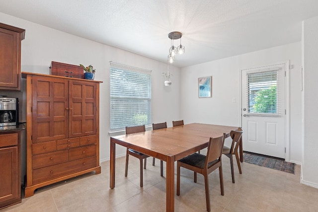 dining space featuring baseboards
