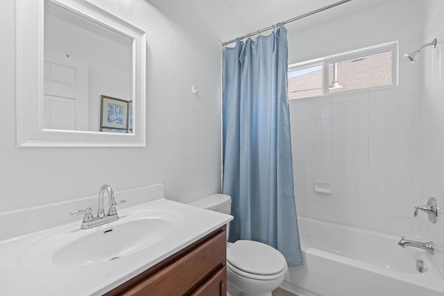 full bathroom featuring toilet, shower / bath combination with curtain, and vanity