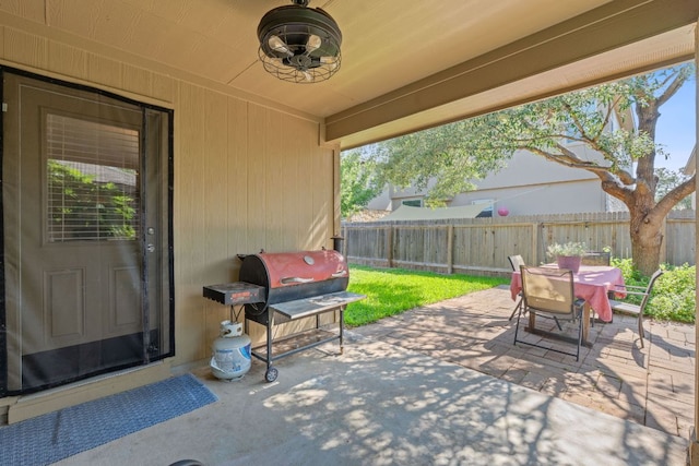 view of patio featuring a fenced backyard, outdoor dining space, and area for grilling