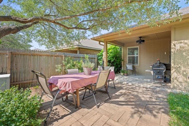 view of patio / terrace with outdoor dining area, fence, grilling area, and ceiling fan