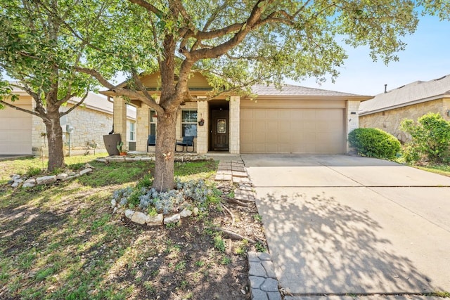 view of front facade featuring concrete driveway and an attached garage