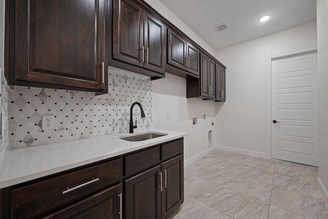 106 Gabriel Woods Dr, Georgetown, TX 78633 - laundry room featuring cabinet space, washer hookup, and recessed lighting