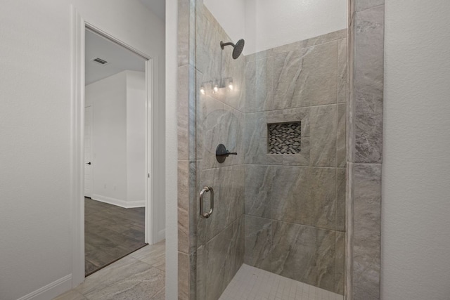 106 Gabriel Woods Dr, Georgetown, TX 78633 - bathroom featuring a stall shower and baseboards