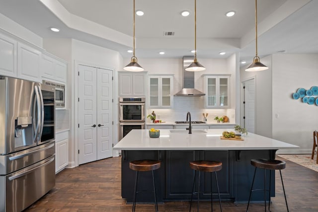 106 Gabriel Woods Dr, Georgetown, TX 78633 - kitchen featuring stainless steel appliances, recessed lighting, decorative backsplash, white cabinetry, and glass insert cabinets