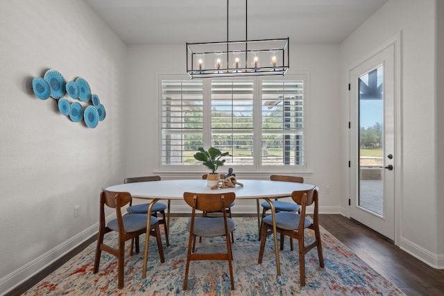 106 Gabriel Woods Dr, Georgetown, TX 78633 - dining space with healthy amount of natural light, a chandelier, and dark wood-style flooring