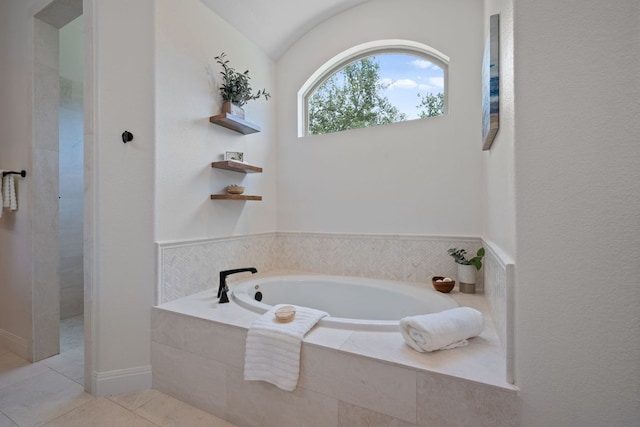106 Gabriel Woods Dr, Georgetown, TX 78633 - bathroom with a bath, tile patterned floors, tiled shower, and vaulted ceiling