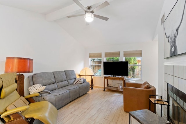 living area featuring a fireplace and ceiling fan