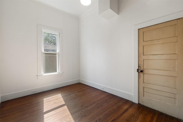 1019 W 4th St, Taylor, TX 76574 - empty room featuring crown molding, wood finished floors, and baseboards