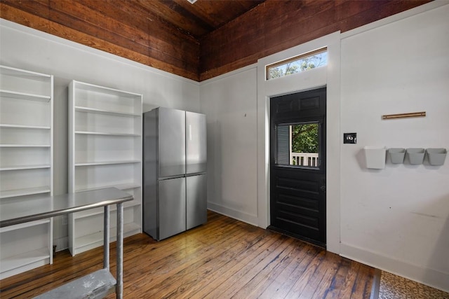 1019 W 4th St, Taylor, TX 76574 - entryway featuring hardwood / wood-style floors, wooden ceiling, and baseboards