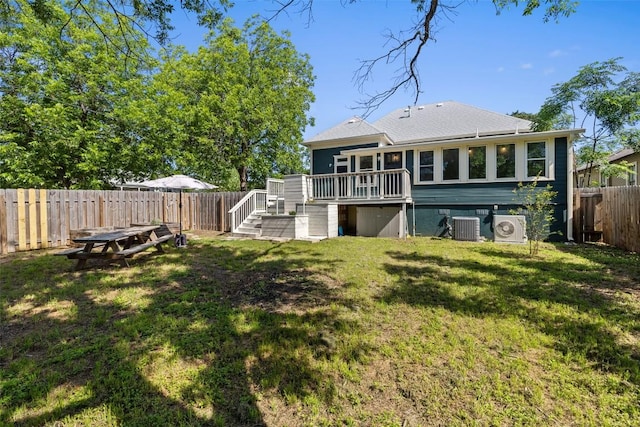 1019 W 4th St, Taylor, TX 76574 - back of house with a deck, central AC unit, roof with shingles, and a cooling unit