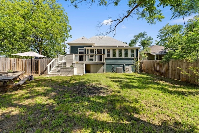 1019 W 4th St, Taylor, TX 76574 - back of property with central air condition unit, a deck, stairway, a sunroom, and roof with shingles
