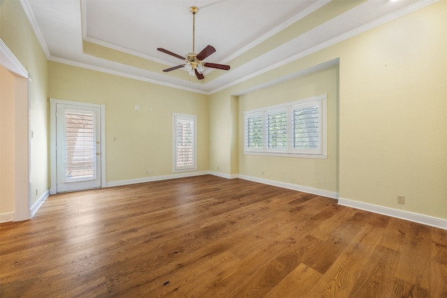 10242 Pinehurst Dr, Austin, TX 78747 - unfurnished room with a tray ceiling, a ceiling fan, wood finished floors, and ornamental molding