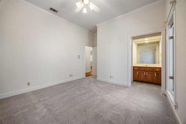10242 Pinehurst Dr, Austin, TX 78747 - unfurnished bedroom with ornamental molding, light colored carpet, baseboards, ensuite bathroom, and ceiling fan