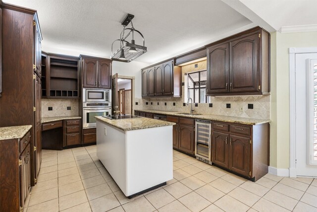 10242 Pinehurst Dr, Austin, TX 78747 - kitchen with stainless steel appliances, beverage cooler, decorative backsplash, dark brown cabinets, and light tile patterned floors