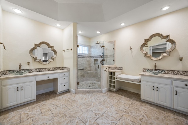 10242 Pinehurst Dr, Austin, TX 78747 - full bathroom with a shower stall, two vanities, and recessed lighting