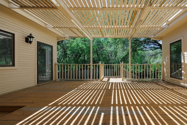 10242 Pinehurst Dr, Austin, TX 78747 - wooden deck featuring a pergola and view of wooded area