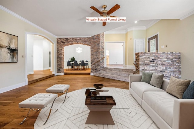 10242 Pinehurst Dr, Austin, TX 78747 - living area featuring arched walkways, ceiling fan, wood finished floors, crown molding, and recessed lighting