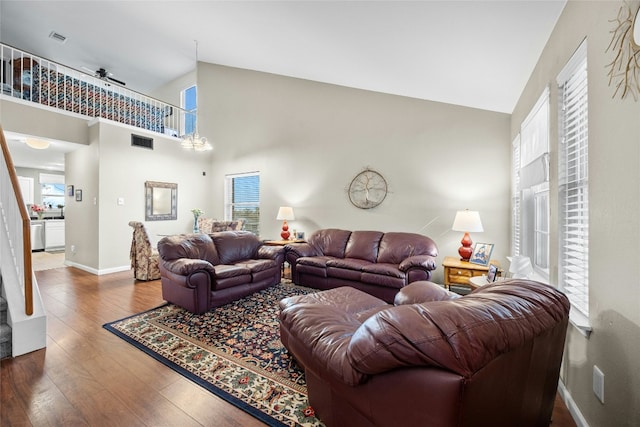 1610 Plume Grass Pl, Round Rock, TX 78665 - living area featuring high vaulted ceiling, plenty of natural light, wood finished floors, baseboards, and a ceiling fan