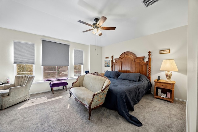 carpeted bedroom featuring a ceiling fan and baseboards